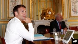 French President Emmanuel Macron during a videoconference on the conoravirus with Group of Seven leaders at the Elysee Palace in Paris, Thursday, April 16, 2020. 