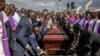 Family and friends carry the coffin during the burial of late Kenyan marathon runner Kelvin Kiptum in Chepkorio on Feb. 23, 2024.