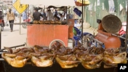 Grilled chickens are sold at a stall in front of the main market in Siem Reap province, some 230 kilometers (143 miles) northwest of the capital Phnom Penh, file photo. 