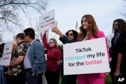 FILE - Devotees of TikTok gather at the Capitol in Washington, on March 13, 2024.