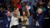 Vice President and Democratic presidential candidate Kamala Harris poses for photos with Democratic vice presidential candidate, Minnesota Gov. Tim Walz, Former U.S. Rep. Gabby Giffords, and Sen. Mark Kelly during a campaign rally, in Glendale, Arizona, Aug. 9, 2024. 