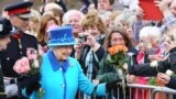 Britain&#39;s Queen Elizabeth II greets well-wishers before she unveils a commemorative plaque at Newtongrange railway station in the village of Midlothian on the day she becomes Britain&#39;s longest reigning monarch.<br />
&nbsp;