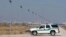 FILE - A U.S. Border Patrol truck sits at the U.S.-Mexico border in El Paso, Texas. 
