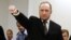 Norwegian mass killer Anders Behring Breivik gestures as he arrives at the court room in Oslo Courthouse August 24, 2012. 