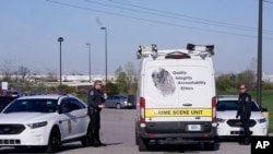 A crime scene vehicle arives where multiple people were shot at the FedEx Ground facility early Friday morning, April 16, 2021, in Indianapolis. 