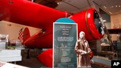 FILE - Amelia Earhart's plane is seen at the Smithsonian's National Air and Space Museum in Washington, Tuesday, Nov. 16, 2010, after an overhaul of one of the museum's original galleries, the "Pioneers of Flight" exhibit. (AP Photo/Jacquelyn Martin, File)