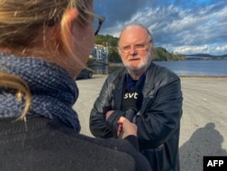 Norwegian playwright Jon Fosse speaks to journalists near Frekhaug, north of Bergen in Norway on October 5, 2023, after the Swedish Academy awarded him the 2023 Nobel literature prize. (Photo by Gunn Berit Wiik / NTB / AFP)