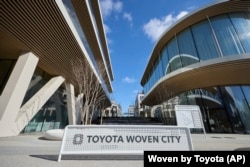 This photo provided by Woven by Toyota shows the sign of Toyota Woven City in Susono city, Shizuoka Prefecture, Feb. 2025.