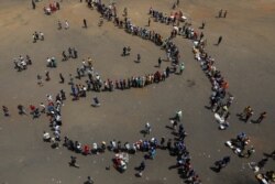 Mourners arrive at Rufaro stadium, in Mbare township where the body of Zimbabwe's founder Robert Mugabe will lie in state, Harare, Sept. 12, 2019.