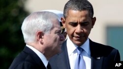 FILE - President Barack Obama attends an Armed Forces Farewell Tribute in honor of outgoing Defense Secretary Robert Gates, left, June 30, 2011