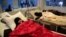 FILE - Women are treated for a suspected cholera infection at a hospital in Sana'a, Yemen, May 15, 2017.