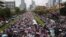 Thai anti-government protesters march on the street during a mass rally in Bangkok, Thailand, Mar. 29, 2014. 