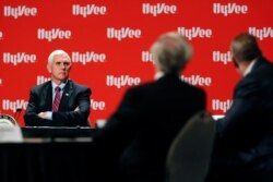 Vice President Mike Pence listens during a roundtable with agriculture and food supply leaders about steps being taken to ensure the food supply remains secure, May 8, 2020, in West Des Moines, Iowa.