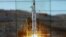 A screen shows the Unha-3 [Milky Way 3] rocket being launched from a launch pad at the West Sea Satellite Launch Site, at North Korea's satellite control centre in Cholsan county, North Pyongan province in this picture released by the official KCNA news a