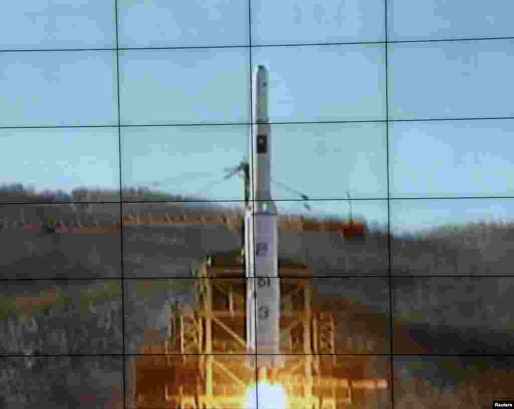 A screen shows the Unha-3 [Milky Way 3] rocket being launched from a launch pad at the West Sea Satellite Launch Site, at North Korea's satellite control centre in Cholsan county, North Pyongan province in this picture released by the official KCNA news a