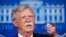 FILE - National security adviser John Bolton speaks to reporters during the daily press briefing at the White House.