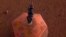 Esta foto facilitada por el Laboratorio de Propulsión a Chorro de la NASA muestra un sismógrafo colocado en suelo de Marte por la sonda InSight. La sonda colocó el dispositivo el miércoles 19 de diciembre de 2018.