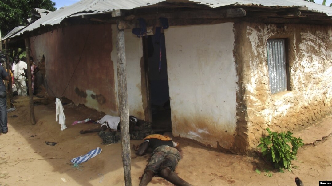 Bodies of men killed in a gun battle at an air force base near Guinea-Bissau's capital, Bissau, October 21, 2012.