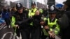 Police officers take away a protester attempting to block the road during a gathering at the site of the former Royal Mint in London to demonstrate against a proposal to move China's embassy to the site in the shadow of the Tower of London, Feb. 8, 2025.