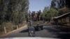 FILE - Soldiers with the Ethiopian National Defense Force (ENDF) travel on a truck near Aykel, on a road that connects Gondar to the Sudanese border in Ethiopia's Amhara region, on Feb. 27, 2024.