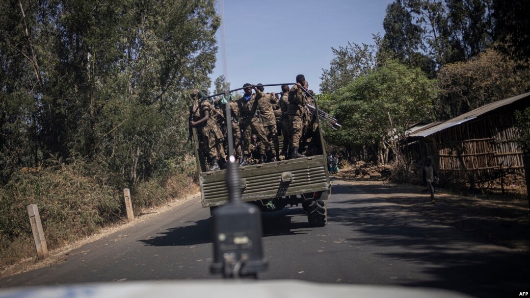 FILE - Soldiers with the Ethiopian National Defense Force (ENDF) travel on a truck near Aykel, on a road that connects Gondar to the Sudanese border in Ethiopia's Amhara region, on Feb. 27, 2024.