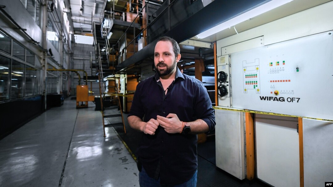 FILE - The General Manager of Venezuelan newspaper El Nacional Jorge Makriniotis speaks during an interview with the AFP, at its printing press in Caracas, June 14, 2019. 