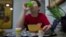 A youngster diagnosed at age eight with Asperger's syndrome takes medication with his breakfast at home on Long Island, New York, March 30, 2012.