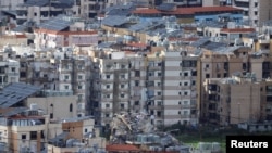 以色列与真主党之间的敌对行动不断升级，图为贝鲁特南郊的建筑遭受损毁。(2026年3月30日)