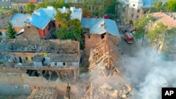 In this photo provided by the Ukrainian Presidential Press Office, an aerial view shows a heavily damaged apartment building after a Russian missile attack that killed several and injured scores more in the western city of Lviv, Ukraine, Sept. 4, 2024.