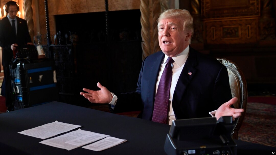 President Donald Trump speaks to reporters following his teleconference with troops from his Mar-a-Lago estate in Palm Beach, Fla., Nov. 22, 2018.