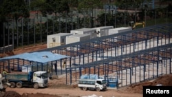 A general view of workers constructing "quick-build" semi-permanent dormitories to house migrant workers amid the coronavirus disease (COVID-19) outbreak in Singapore, June 9, 2020. 