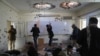 FILE - Journalists photograph inside Kabul University after a deadly attack in Kabul, Afghanistan, Nov. 3, 2020.