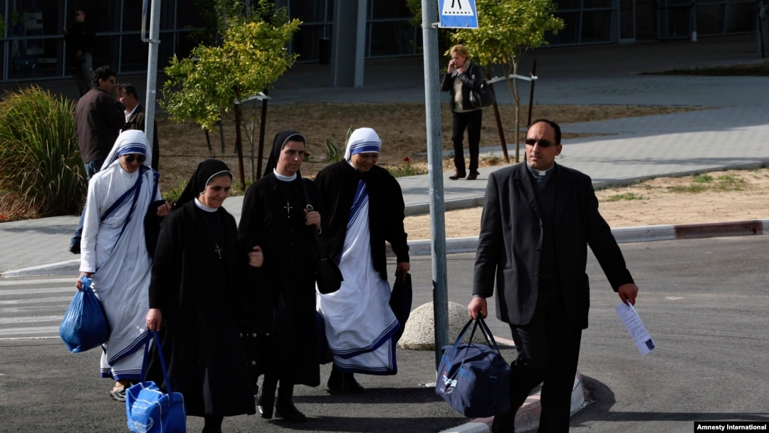 FILE - Catholic nuns and a priest arrive on the Israeli side of the Erez Crossing, after leaving the Gaza Strip.