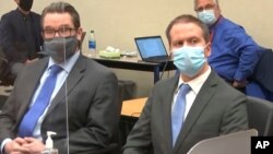 FILE - In this image from video, defense attorney Eric Nelson, left, and former Minneapolis police Officer Derek Chauvin are set for the verdict in Chauvin's trial for the 2020 death of George Floyd.