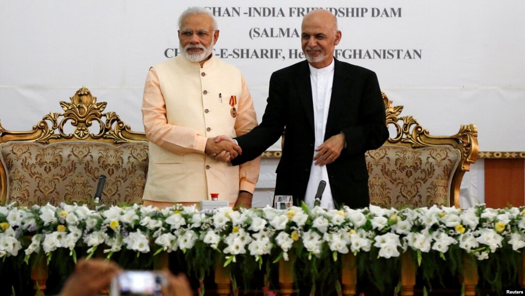 India's Prime Minister Narendra Modi (left) and Afghanistan's president Ashraf Ghani shake hands during the inauguration of the Salma Dam in Herat province, Afghanistan, June 4, 2016.