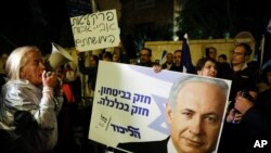 Supporters of Israeli Prime Minister Benjamin Netanyahu gather outside his residence in Jerusalem, Nov. 21, 2019.