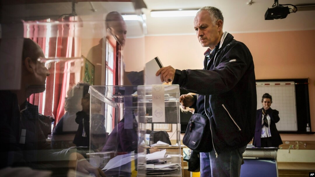 A voter casts his vote at a polling station in Sofia, April 2, 2023.