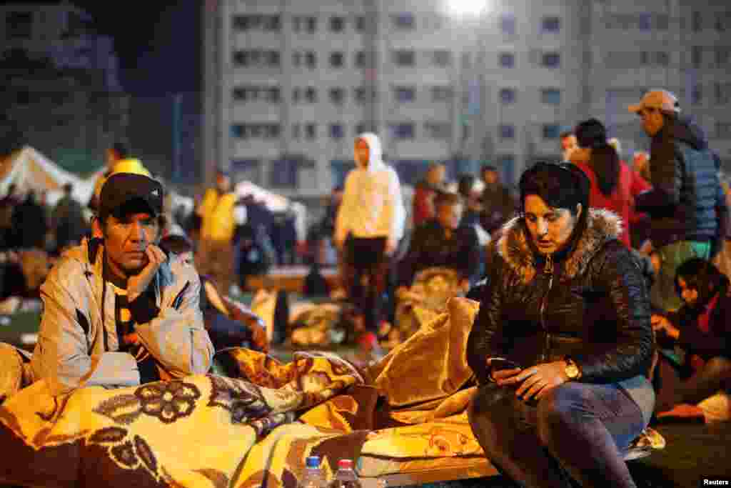 Citizens rest at a makeshift camp in Durres, after an earthquake shook Albania, Nov. 26, 2019. 