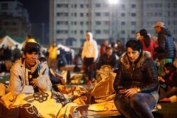 Citizens rest at a makeshift camp in Durres, after an earthquake shook Albania, Nov. 26, 2019.
