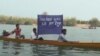 Villagers living along the Sesan river in northeastern Cambodia protest the construction of the Sesan 2 dam in March 2013. The construction of the hydropower dam would force as many as 1,500 families to resettle.