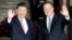 China's President Xi Jinping and his Panamanian counterpart Juan Carlos Varela wave to journalists before a private meeting as part of Xi's first state visit to Panama, at Presidential Palace in Panama City, Panama, Dec. 3, 2018. 
