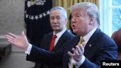 FILE - U.S. President Donald Trump speaks while meeting with China's Vice Premier Liu He in the Oval Office of the White House in Washington, April 4, 2019.