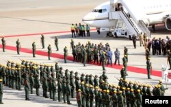 The body of former Zimbabwean President Robert Mugabe arrives back in the country after he died in Singapore after a long illness, Harare, Sept. 11, 2019.