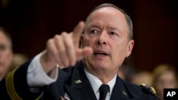 National Security Agency (NSA) Director Gen. Keith Alexander testifies on Capitol Hill in Washington, Wednesday, Dec. 11, 2013, before the Senate Judiciary Committee hearing on "Continued Oversight of U.S. Government Surveillance Authorities". (AP Photo/Manuel Balce Ceneta)