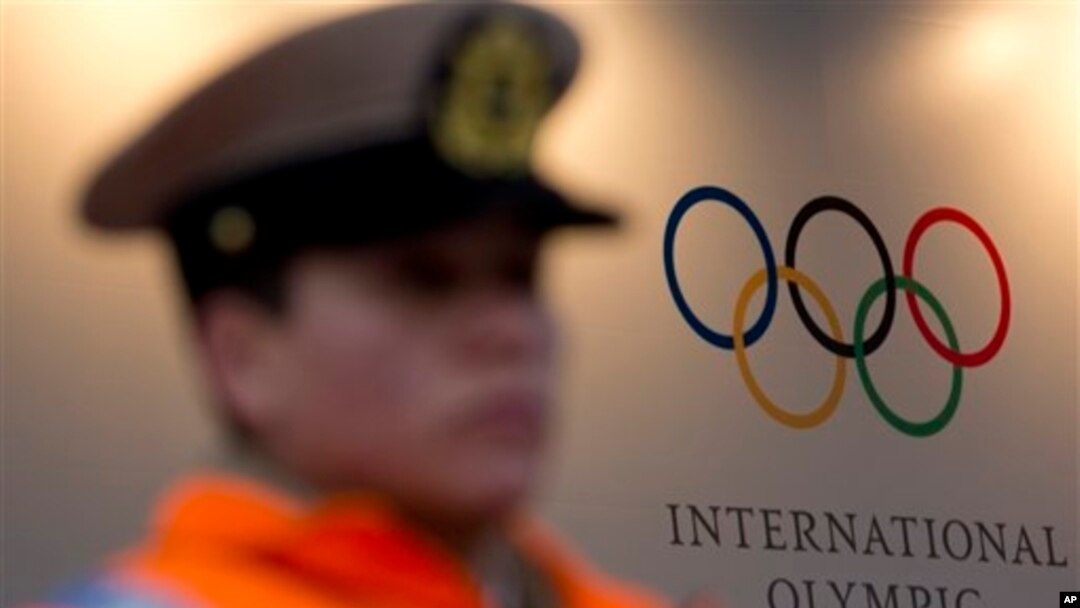 Police officer guards hotel where International Olympic Committee executive board is meeting, Buenos Aires, Argentina, Sept. 5, 2013.