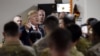 FILE - President Donald Trump greets soldiers after speaking to the troops during a surprise Thanksgiving Day visit at Bagram Air Field, on Nov. 28, 2019, in Afghanistan.