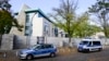 FILE - Police cars stand in front of the Israeli embassy in Berlin, on Oct. 20, 2024.