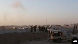 Moshi ukionekana hewani baada ya shambulizi la Marekani dhidi ya vituo vya wanamgambo wa Isamic State karibu na Khazer kaskazini mwa Irak