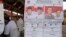 Poster bergambar kedua pasang kandidat pemilihan presiden Indonesia 2014. (AP/Firdia Lisnawati)