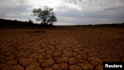 FILE - Cracked earth is seen in the South African Karoo, which energy companies are reportedly eying for fracking.